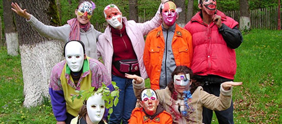 Photo of 8 people posing with their masks